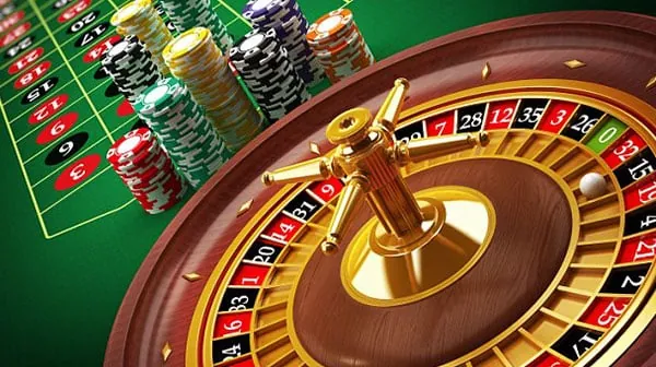 Poker table with chips and cards, showing intense player focus